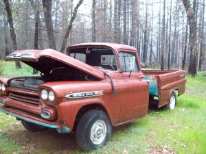 I couldn't find an image of a car with a white piece of clothing at the top of a closed window, but I liked this one of a broken down car anyway, so here it is :)