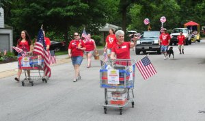 Mary Kay walking with Food for Tomorrow on 4th July