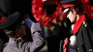 Prince Harry lays a wreath on behalf of his father