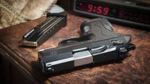 They told me they keep their guns in their bedside table. I've got my lip balm, my earbuds, my Kindle and my old cuddly blanket in my bedside table ;)