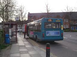 A bus and a bus stop creating public transportation - it's marvellous!